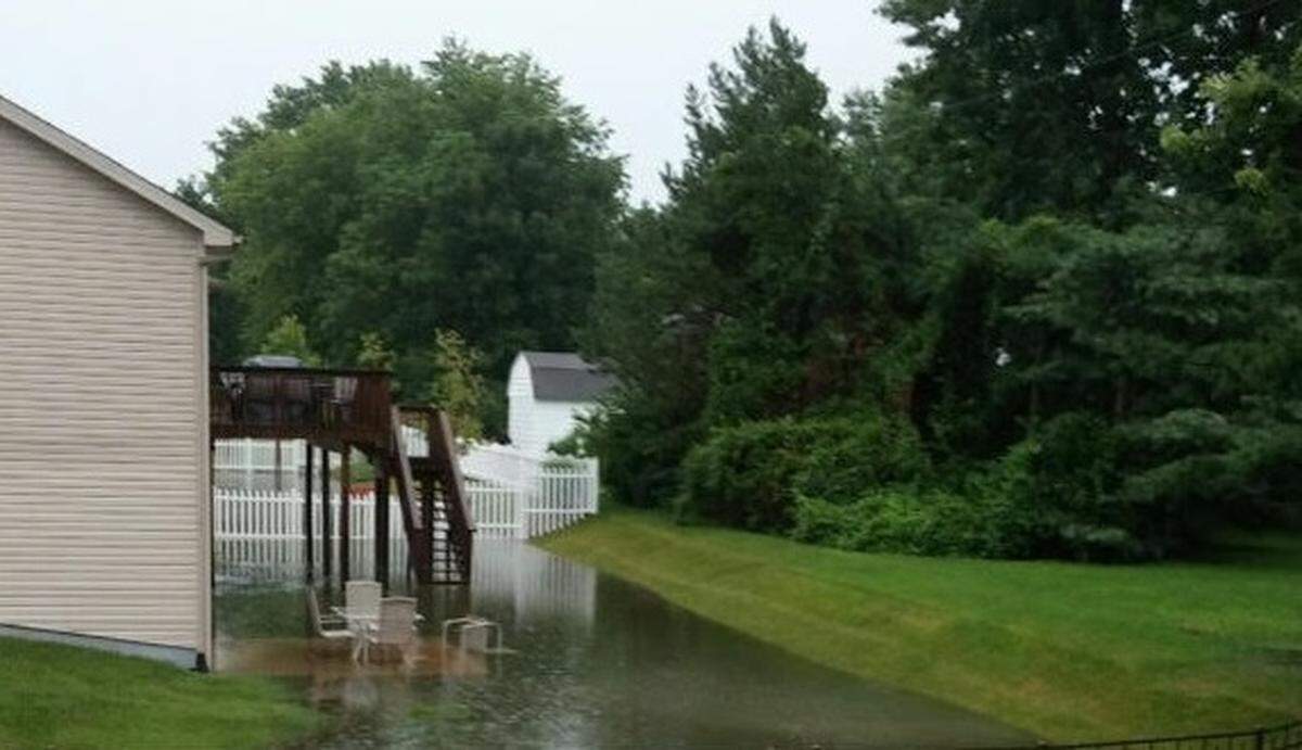 This photo shows Connie Seneczyn’s flooded backyard.