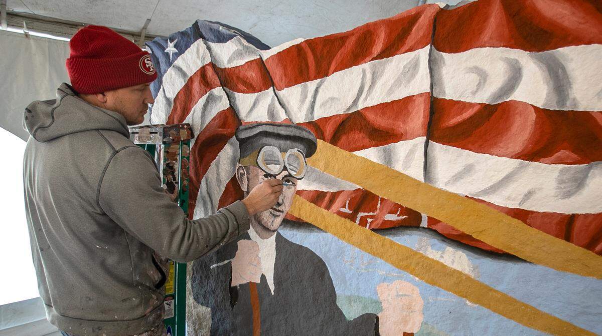 Mural Artist, Ray “Bubba” Sorensen II, paints a Freedom Rock in Shiloh. Sorensen is known for his original Freedom Rock he painted in 1999 in Iowa, now there is one in every county in Iowa. He is continuing to honor veterans with The 50 State Freedom Rock Tour by thanking Veterans and providing a unique Freedom Rock for all 50 states in America.
