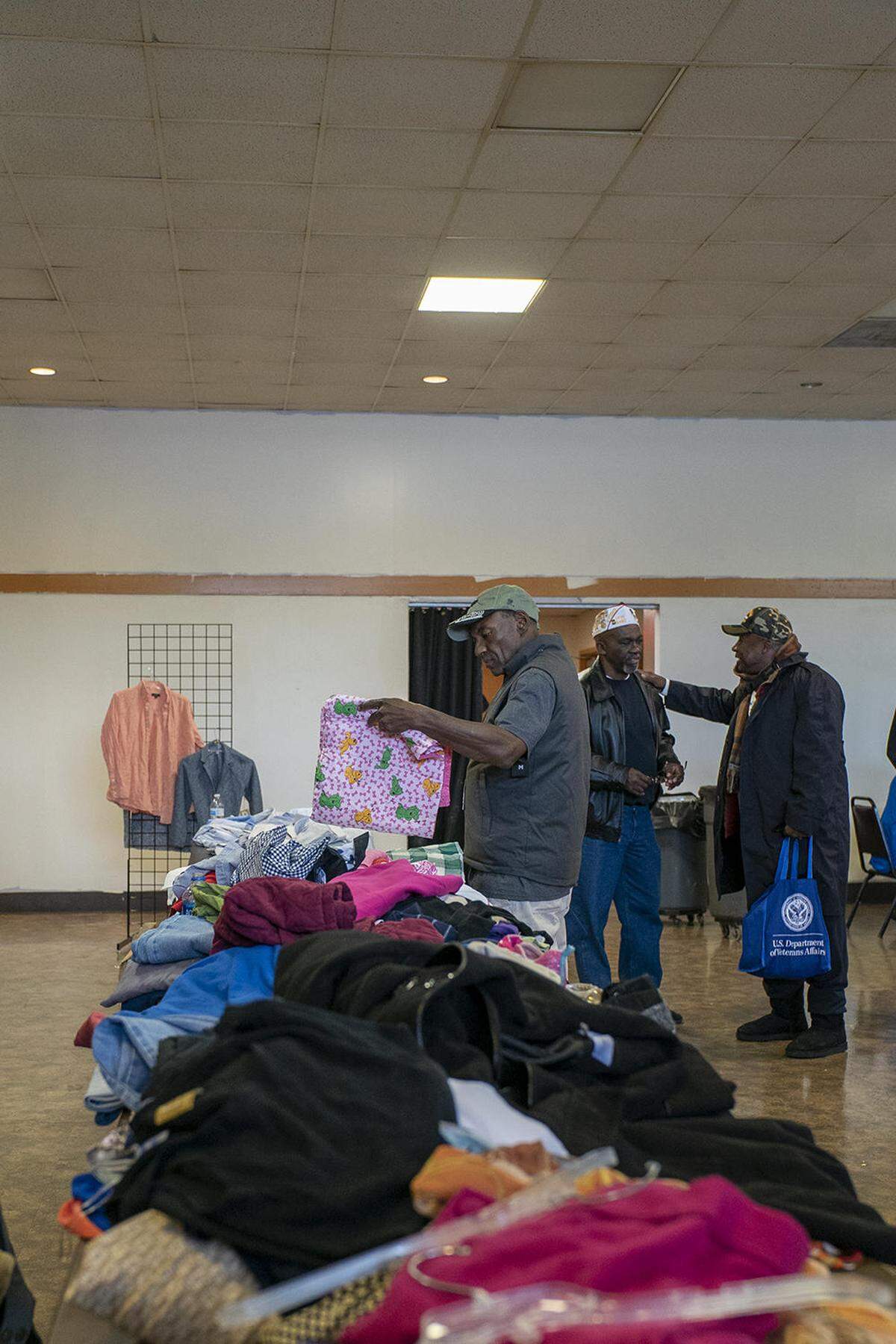 A man looks through free clothing at a St. Clair County veterans stand-down on Oct. 29. The event provided area veterans with clothing, hot meals and other services.