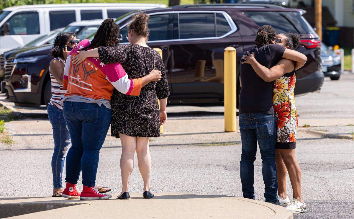 Friends and relatives of Zachary Capers console each other outside the Madison County Criminal Justice Center in Edwardsville on Tuesday after Capers pleaded guilty but mentally ill to first-degree murder.