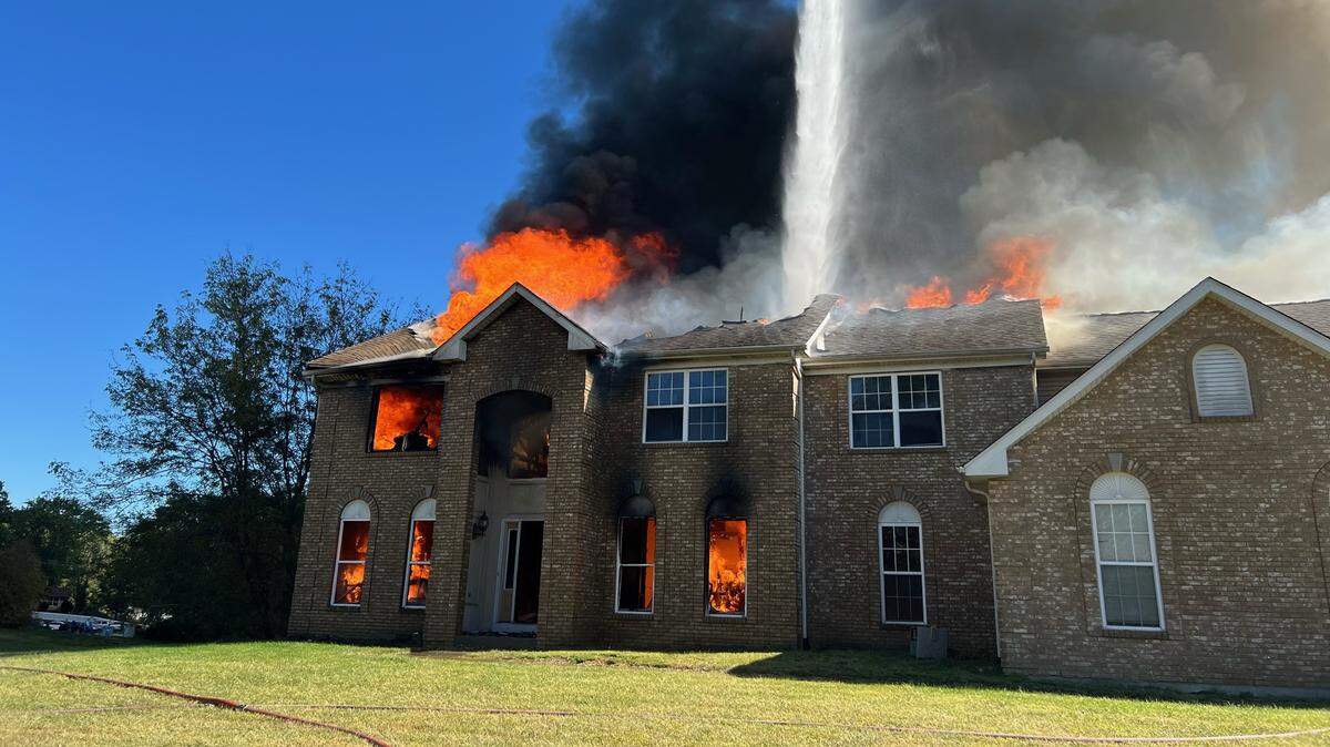 Firefighters battle a blaze at a Swansea home on Sunday. No injuries were reported.