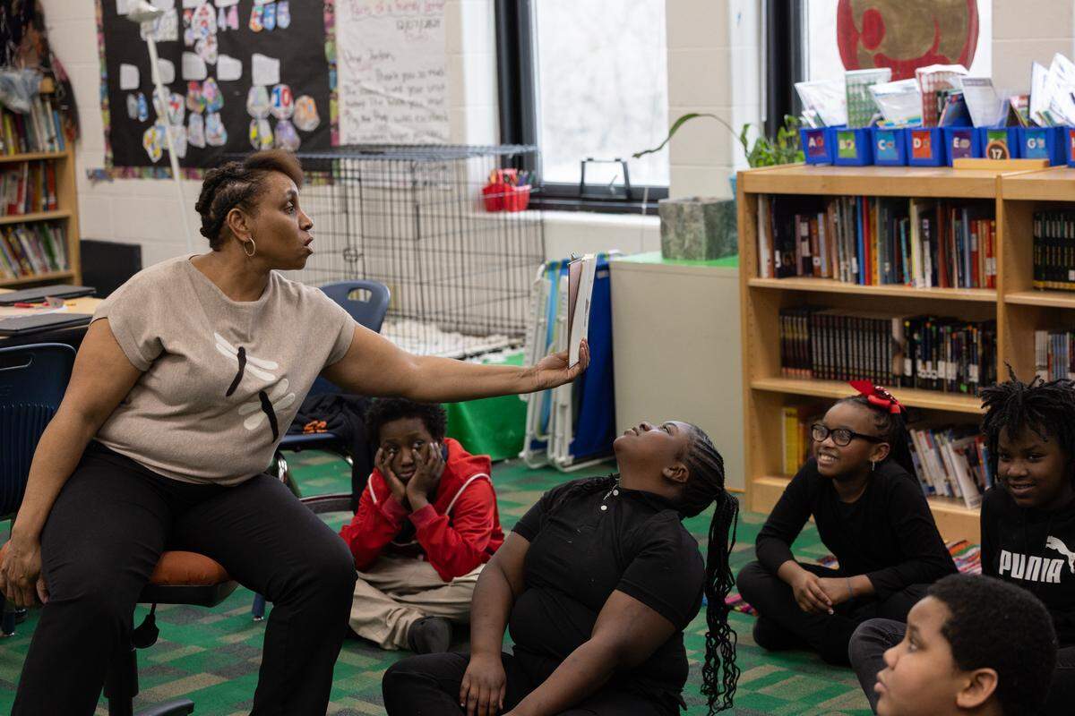 Nina McLean of James Avant Elementary reads “Charlie and the Chocolate Factory” to a group of fifth graders during class. McLean was recently named Illinois Southern Regional Teacher of the Year, which means she’s a finalist for the statewide Teacher of the Year title.