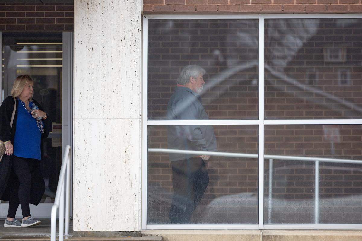 The parents of Sammy Shafer Jr., who is accused of hiring two men to murder 32-year-old Collinsville woman Portia Rowland, exit the Madison County Criminal Justice Center on Feb. 5, 2025.