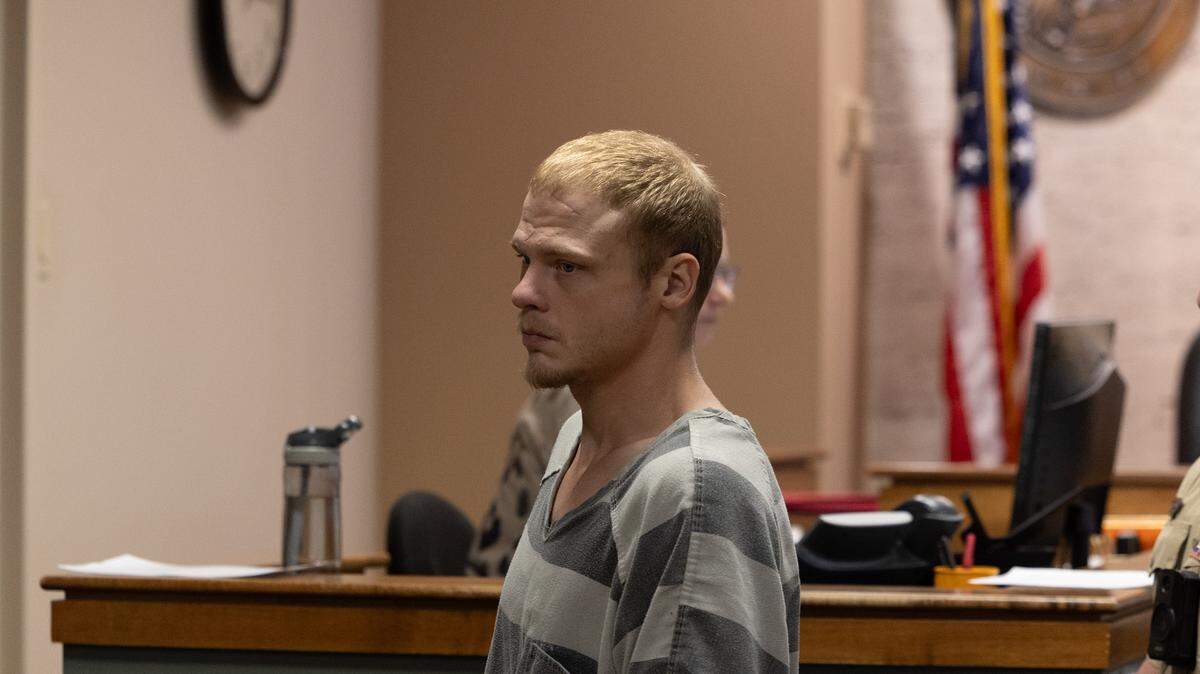 DJ W. Marshall, 26, who is accused of shooting and injuring Granite City Police Officer Tyler Timmons, exits the courtroom at the Madison County Criminal Justice Center, where he waived a pretrial detention hearing on Thursday.