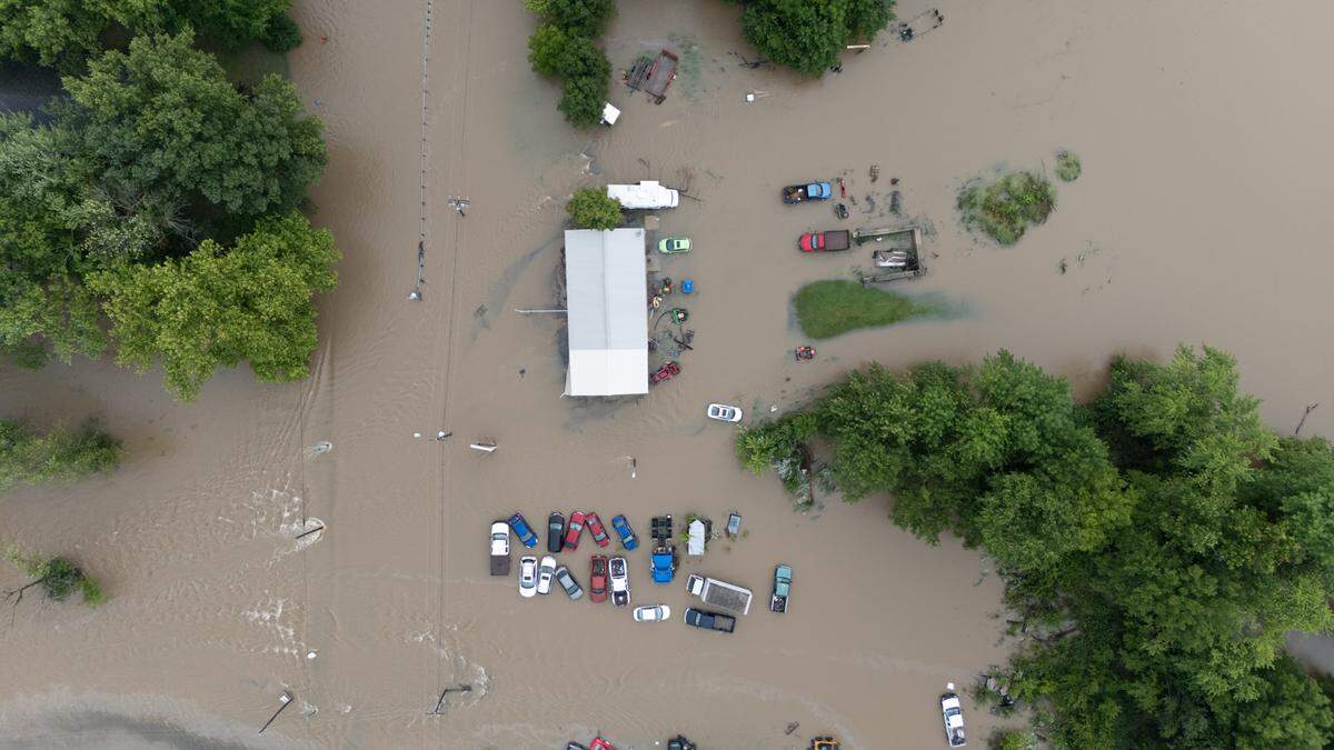 Flooding along E. St. Louis St. in Nashville, Ill., along the path where the dam spilled over, on July 16, 2024.