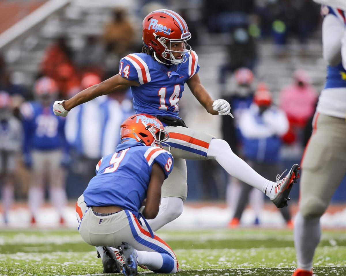November 12, 2022 - East St. Louis, IL - East St. Louis kicker Rico Bond kicks an extra point during the IHSA, 6A, Quarterfinal playoff game between Crete - Monee and East St. Louis. The 45-0 victory will advance the Flyers to the Semifinals. [Photo: Chris Johns]