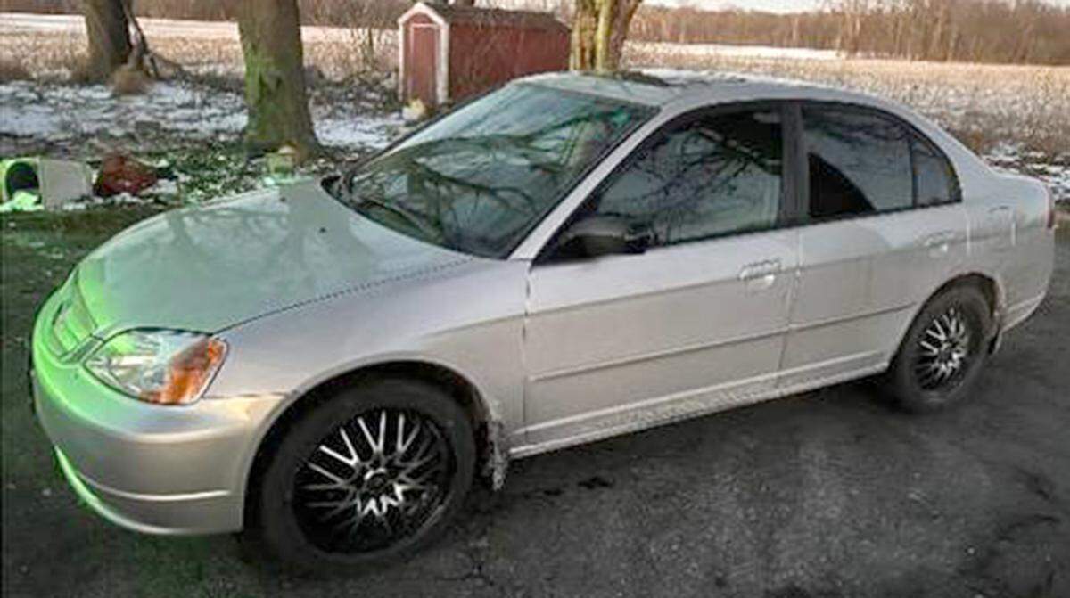 David Foster drives a silver 2002 Honda Civic with distinctive wheels.