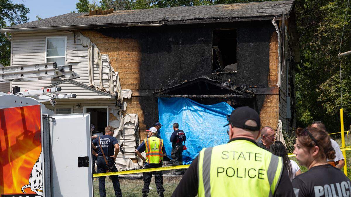 Outside of the scene of a crime where a vehicle crashed into a house on South Eighth Street in Belleville on the morning of Aug. 11, 2024.