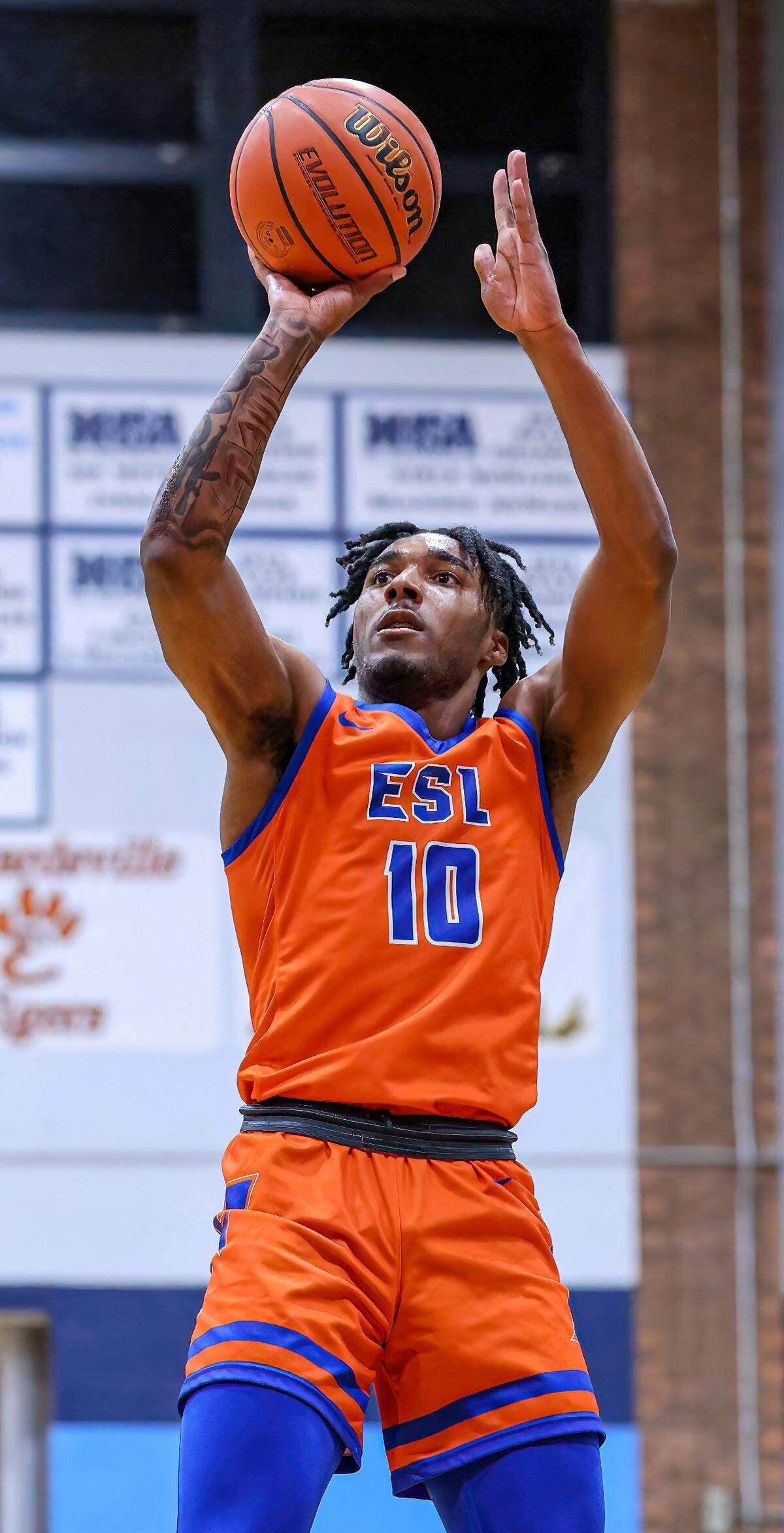 East St. Louis’ Antwan Robinson rises for a shot against Belleville East during a Southwestern Conference game this season. Robinson and the Flyers are gunning for the IHSA Class 3A state championship this weekend.