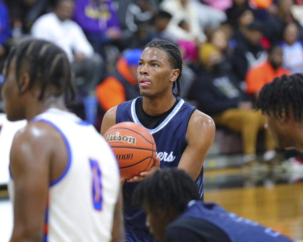 Belleville East’s Jordan Pickett eyes up the basket before a free-throw during Tuesday night’s Southwestern Conference game against East St. Louis. The Flyers ultimately posted a 72-71 victory.