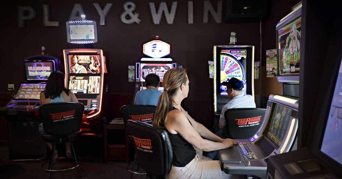 Customers sit at slot and poker machines at Hunan Hibachi Buffet in Waukegan in this 2019 file photo. The Chinese restaurant didn’t serve food until 11 a.m., but video gambling started at 8 a.m.