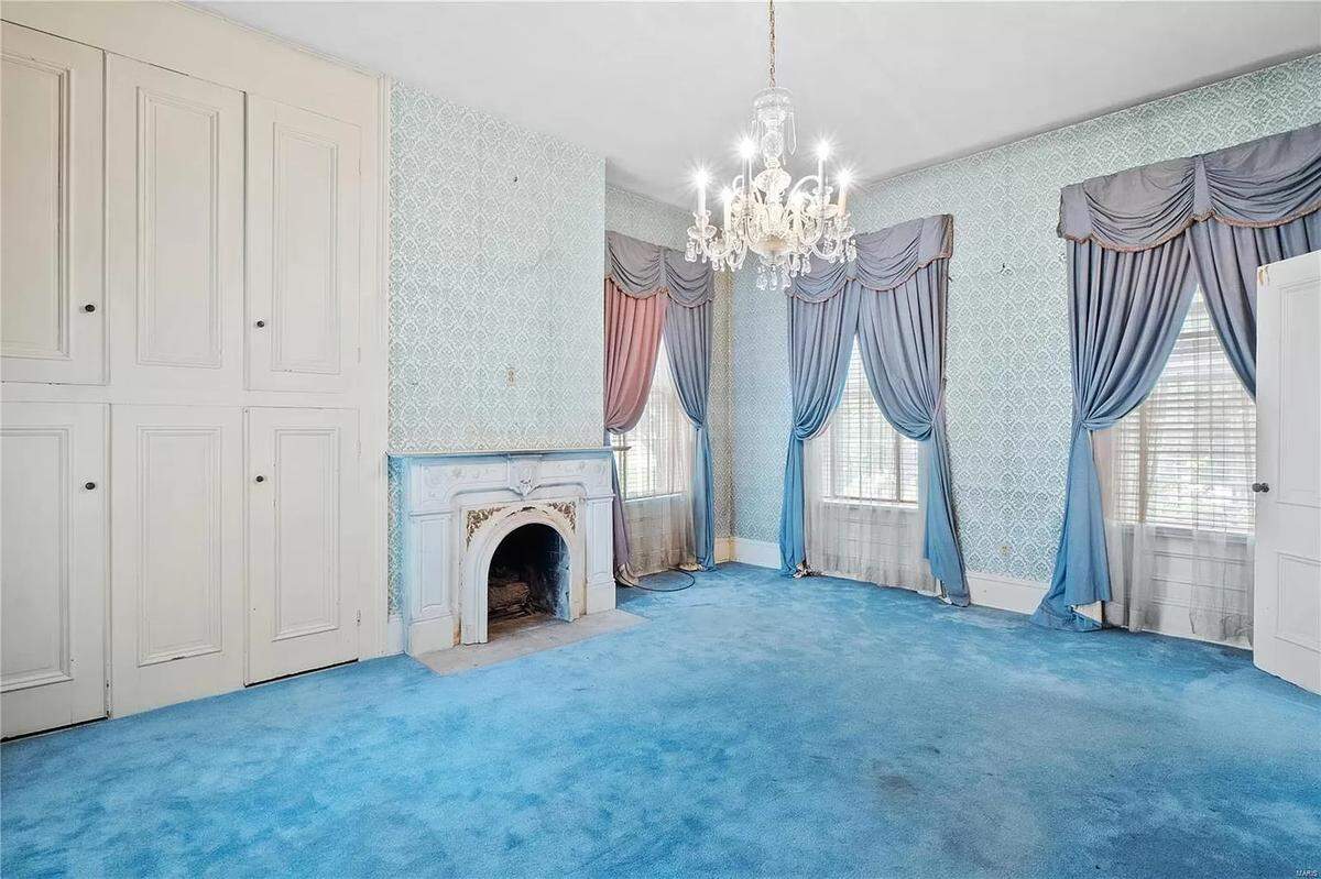 A room inside the Chenot mansion today includes a chandelier and one of the five fireplaces in the home.
