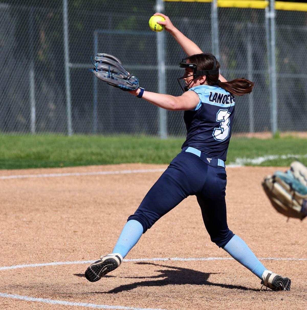 Belleville East senior pitcher Olivia Hemmerle winds up during a game against Red Bud Friday.
