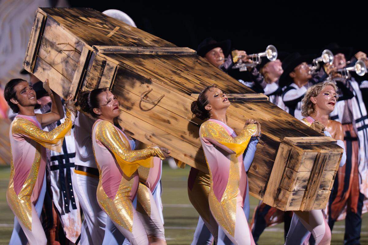 The Troopers Drum and Bugle Corps, of Casper, Wyoming, perform their show The Final Sunset at Belleville West High School on Tuesday, July 22, 2025, in Belleville.