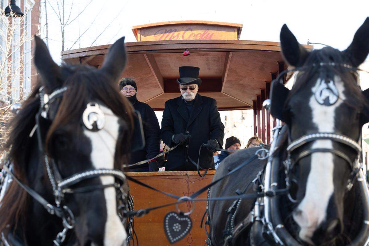 A horse drawn carriage, a staple of downtown Belleville during the holiday season, makes its way down Belleville’s Main Street during the 2025 annual Santa Parade.
