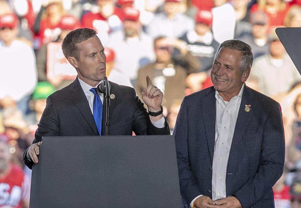 Congressmen Rodney Davis and Mike Bost speak before the arrival of President Donald Trump at the Make America Great Again rally in Murphysboro on Oct. 27, 2018.