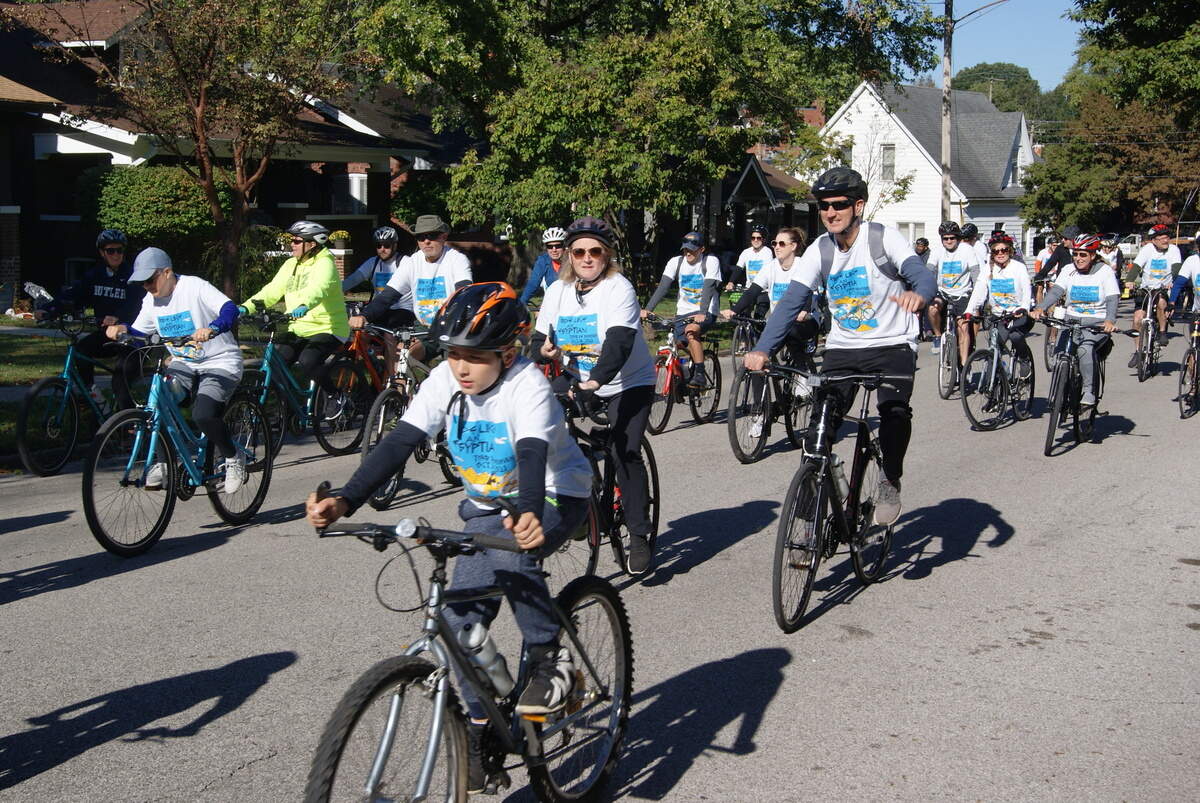 Tour de Belleville cyclists ride near the starting line on Douglas Avenue on Saturday.