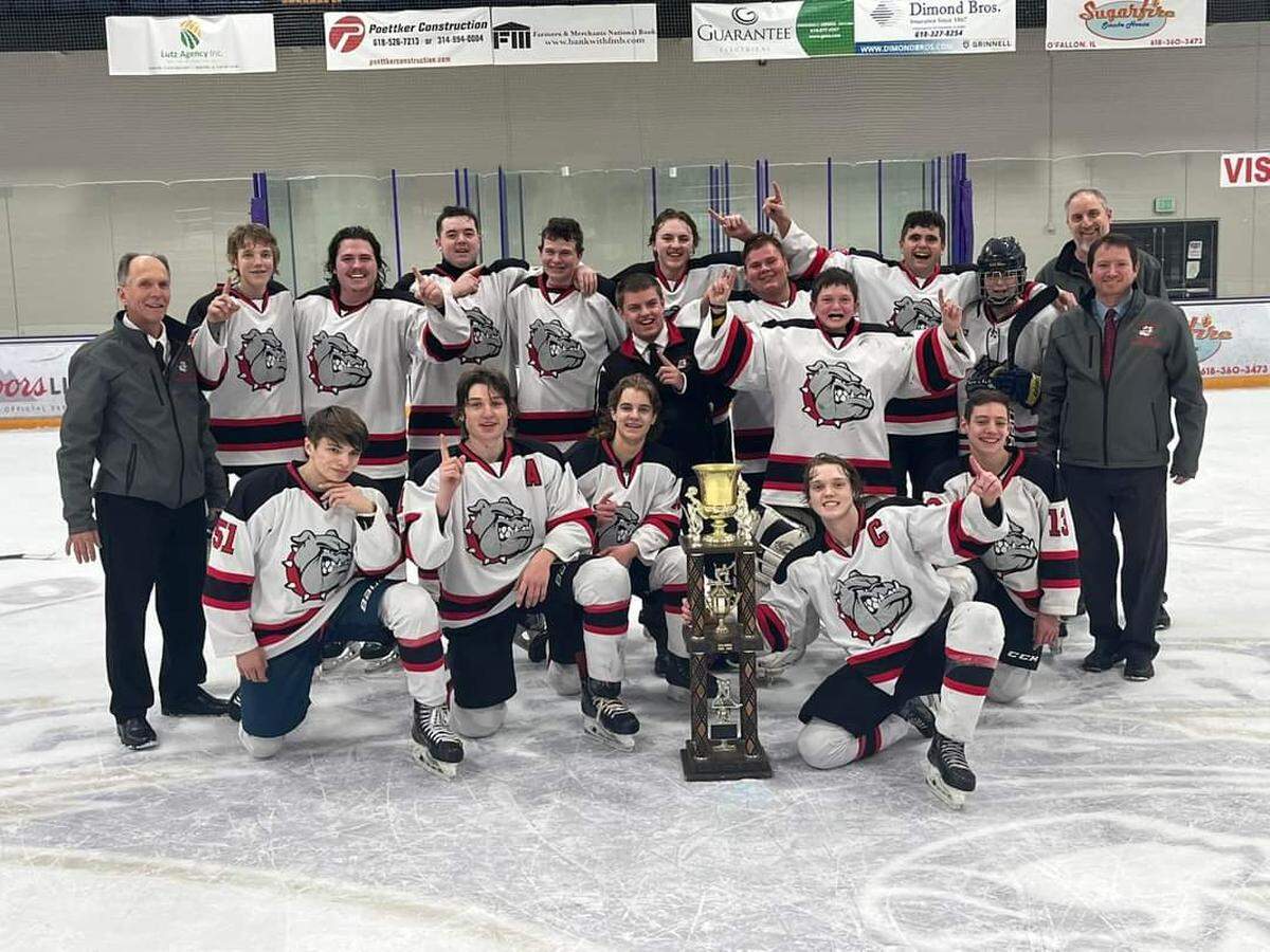 Pictured is the Highland hockey team after winning the MVCHA Class 1A championship at McKendree Metro Rec Plex in O’Fallon. The Bulldogs defeated Alton 2-1 in the third and deciding game of the series.