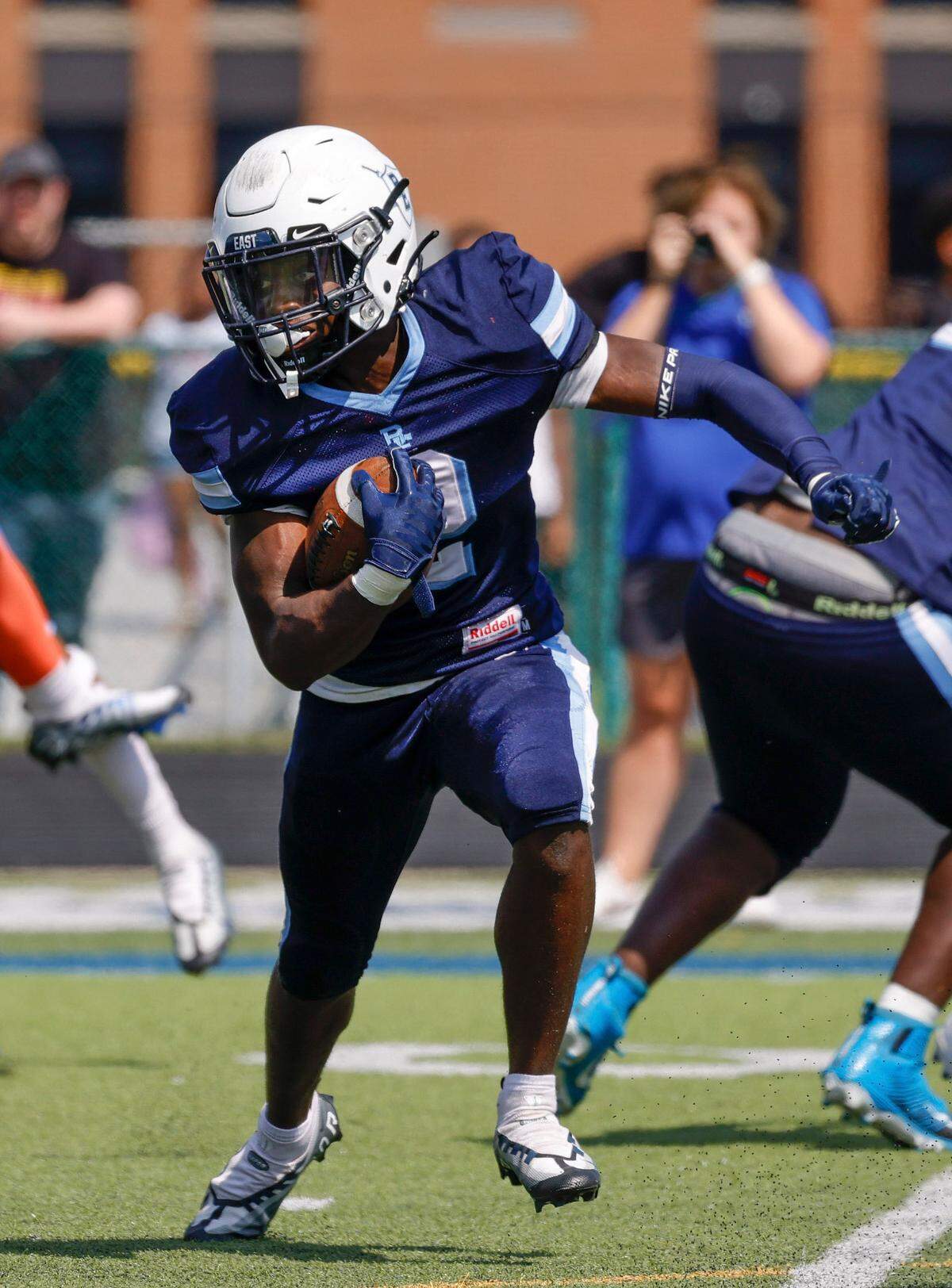 Belleville East’s Markevious Curition runs the ball against visiting East St. Louis during a Southwestern Conference game Saturday. The Lancers fell to the Flyers 57-0.