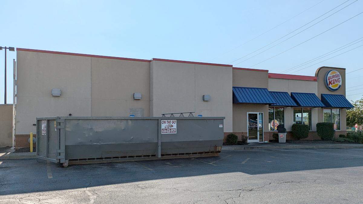 A large dumpster sits in the lot of the Green Mount Commons Burger King in Belleville.