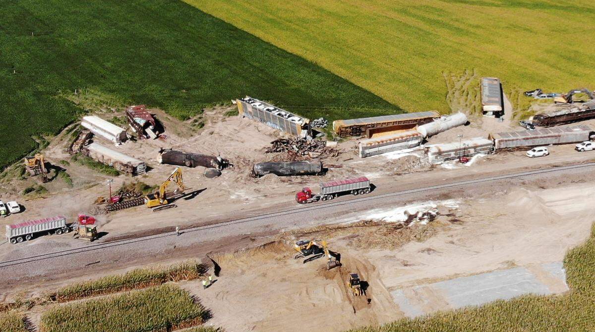 Work crews clean up the the area around the Norfolk Southern train derailment near the intersection of Winter Road in Albers, Illinois. First-responders received a call at 11:22 a.m. on Monday September 19th about a derailment of a Norfolk Southern cargo train between Albers and New Baden along Illinois 161. An estimated 20 to 25 cars in the middle of the train were off the tracks.
