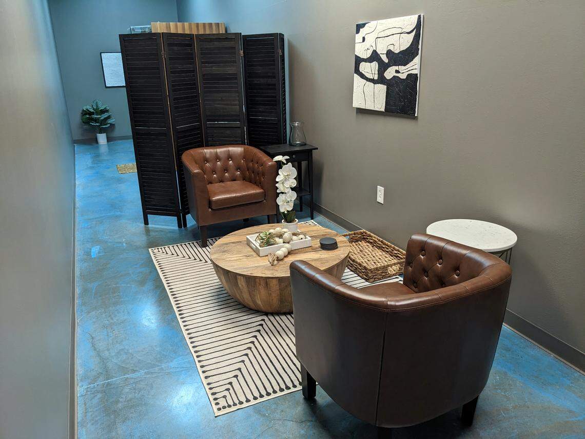 This seating area is where Go Yoga! Express life coaching sessions are held. The infrared sauna is behind the wooden partition.