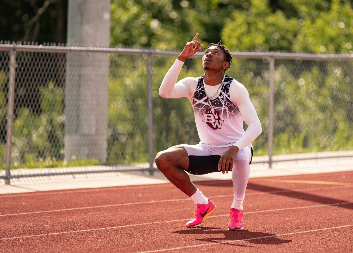 Belleville West’s Troy McLean pauses for a moment of gratitude during a recent track meet. McLean’s coaches, including former Olympic Gold Medalist Dawn Harper-Nelson, believe he’ll run the 400 meters for the U.S. in the 2028 Los Angeles Olympics.