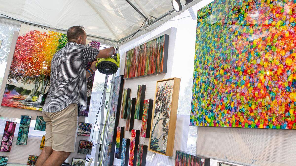 Abstract expressionist artist Robert Cornman is shown installing a few fans in his booth at last year’s Midwest Salute to the Arts in Fairview Heights. Cornman return to this year’s festival, which takes place at Moody Park in Fairview Heights, starting Friday night. This art festival has something for everyone, including art demonstrations by local artist groups, live music, food and beverage vendors, and, of course, art.