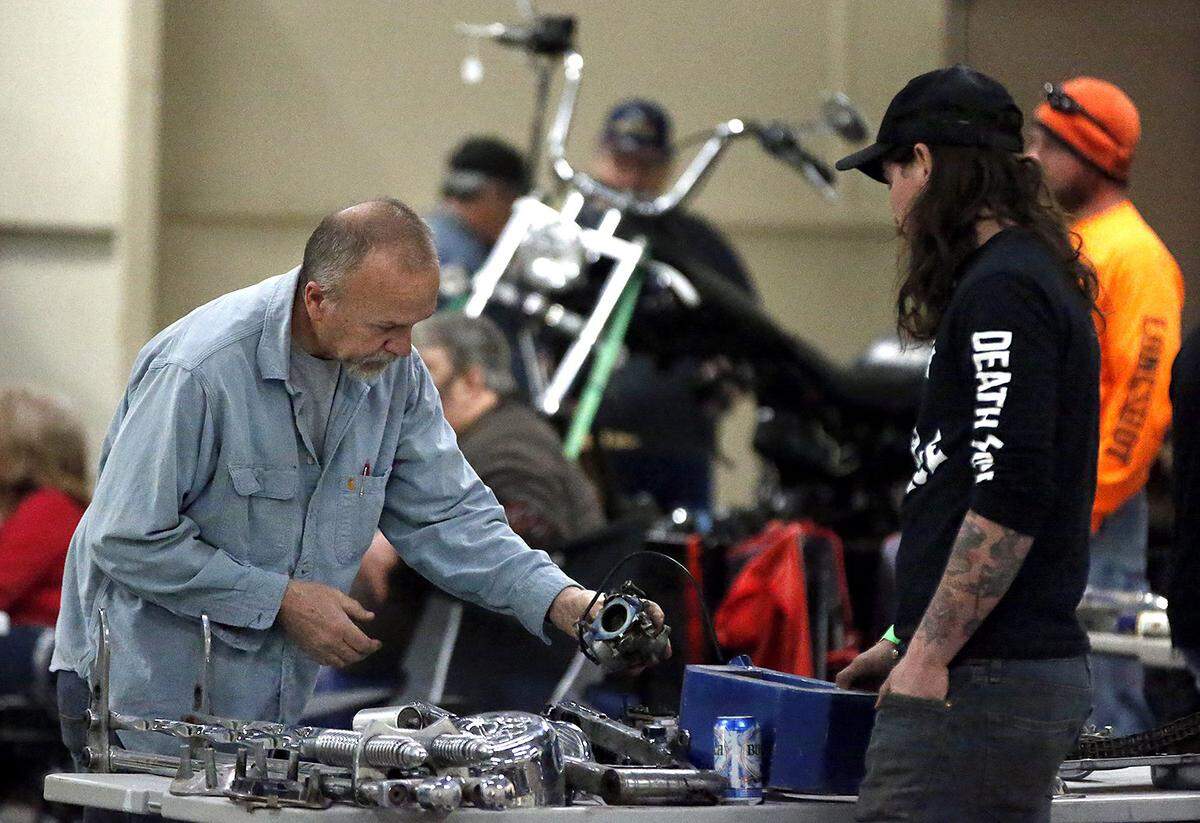 Kent Wiehle (left) of Iuka, Illinois, finds a few used carburetors for his 1982 Harley-Davidson motorcycle at a past motorcycle swap meet at the Belle-Clair Fairgrounds & Expo Center in Belleville. This year’s event takes place Saturday and Sunday with early bird admission from 7 to 10 a.m. and general admission from 10 a.m. to 3 p.m. For more information, visit www.bcfairgrounds.net.