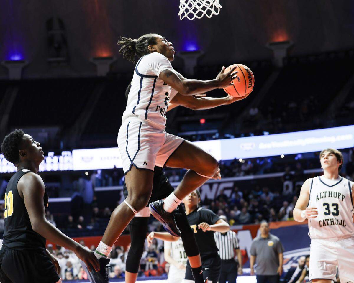 March 15, 2025 - , - Belleville Althoff’s Dierre Hill Jr. drives to the basket during the IHSA, 2A championship game against Chicago (Dyett) at the State Farm Center in Champaign. [Photo: Chris Johns]