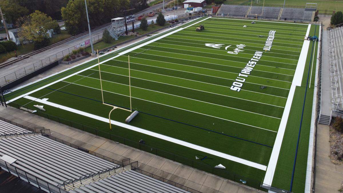 New artificial turf is being installed on the football field at the Southwestern Illinois Justice & Workforce Development Campus. The logos and lettering don’t look uniform because they aren’t sewn in place yet.