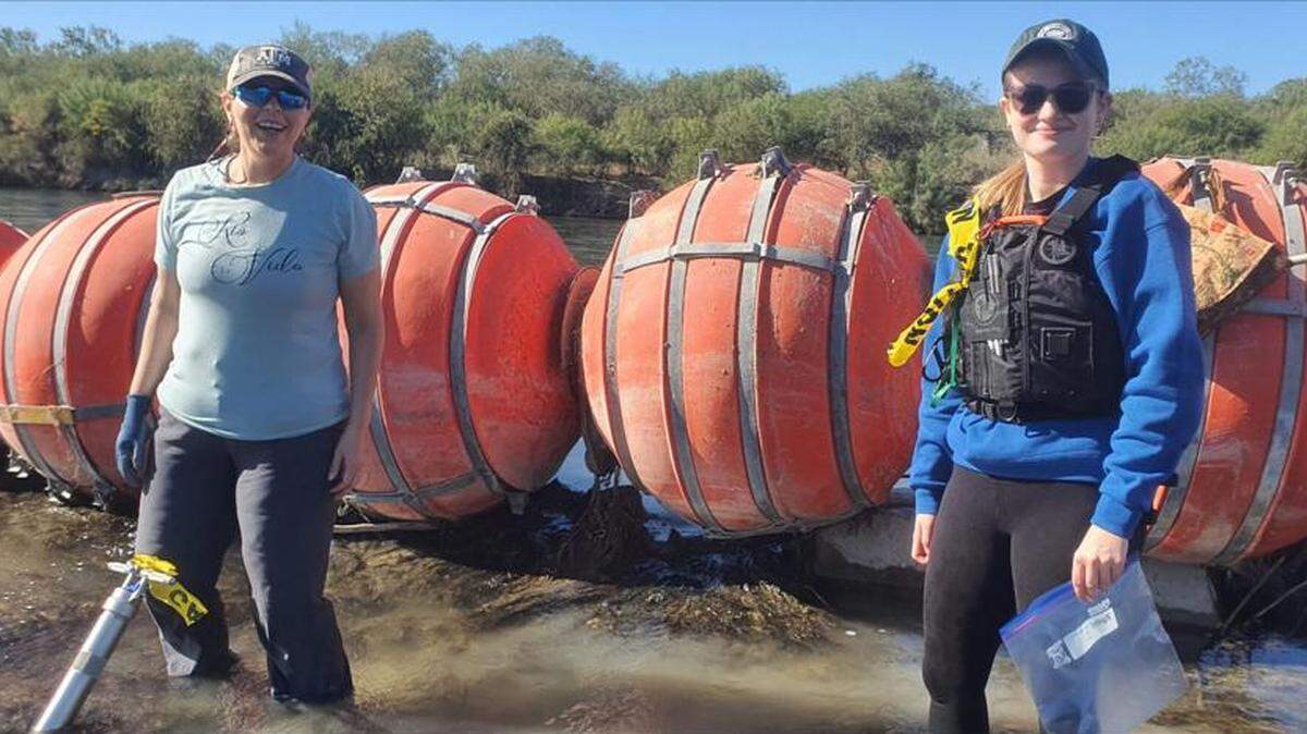 Southern Illinois University Edwardsville professor Adriana Martinez, left, and third-year student Emma Prott, right, have been studying the effects of the buoys placed in the Rio Grande by Texas officials in July 2023.