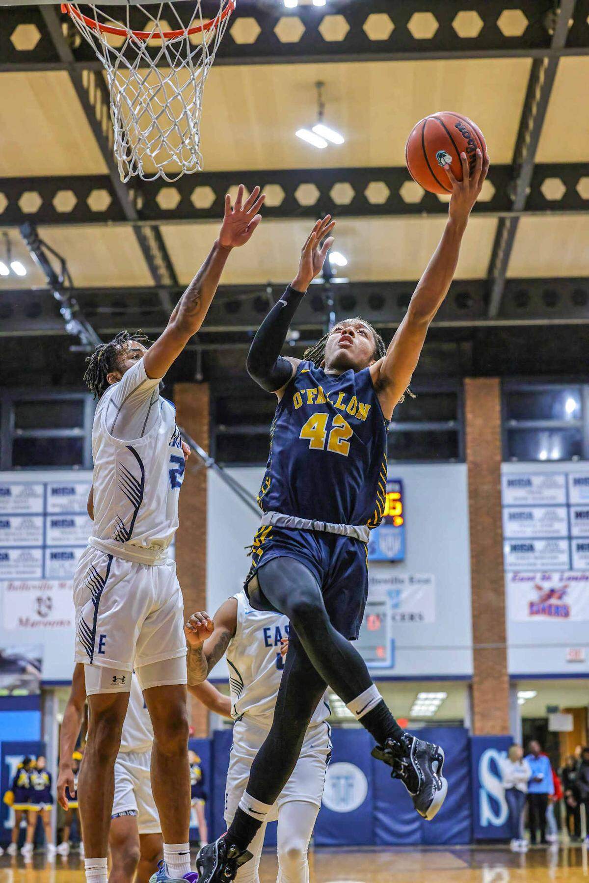 O’Fallon’s Rini Harris lays the ball up during Friday night’s Southwestern Conference game against Belleville East. The Panthers ultimately posted a 65-51 victory.