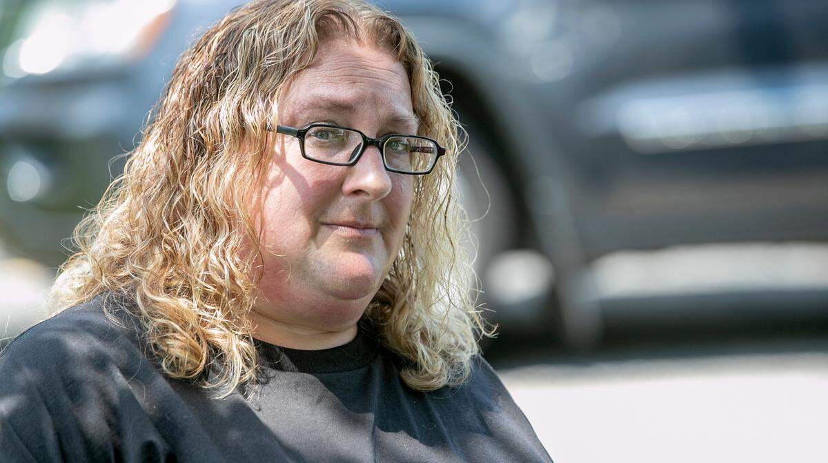 Lori Murray, of Granite City, talks to a member of the media after a protest supporting Kyle Swanson, founding leader of KTS Predator Hunters, didn’t happen on Friday. It was supposed to be held at Spencer T. Olin Community Golf Course in Alton, where State’s Attorney Tom Haine was holding a fundraiser.
