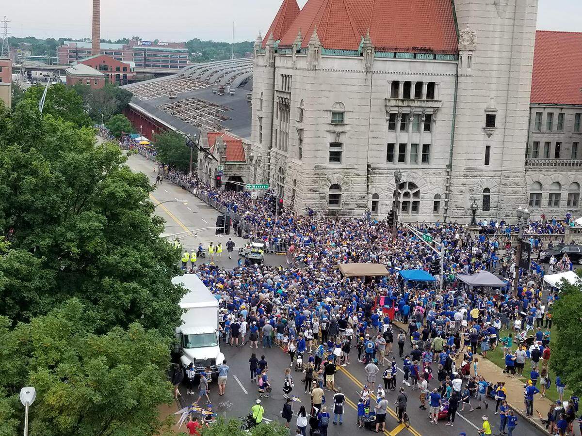 A crowd mills around in front of Union Station at the conclusion of the parade to celebate the St. Louis Blues winning the Stanley Cup.