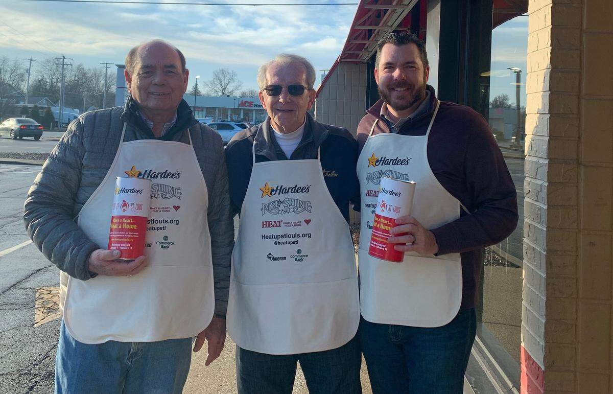 Herb volunteering for Hardees’ Heat Up St Louis fundraising, with City Clerk Jerry Mouser and son Todd Roach