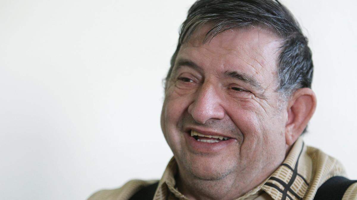This file photo shows Joe Hubbard in 2010 when he was talking with co-workers.