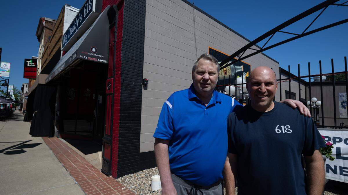 Scott Schmelzel and James “Jimbo” Sinovic, co-owners of Big Daddy’s 618 in Belleville, stand in front of their bar on East Main Street. They’re planning to close the bar next March after 20 years.