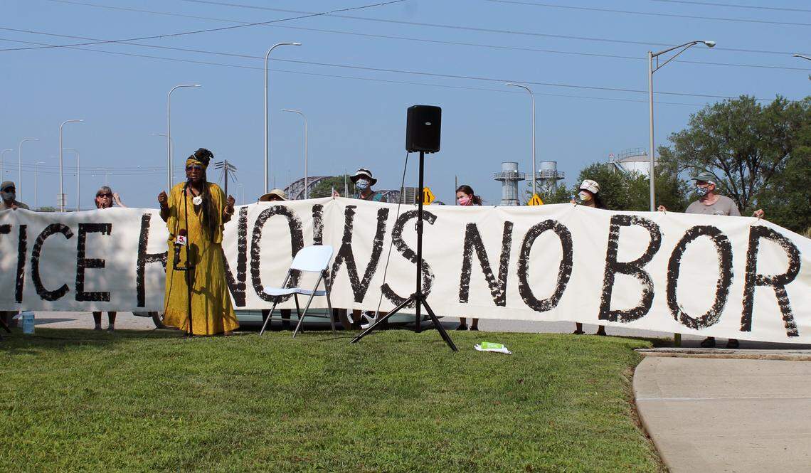 East St. Louis resident Mamie Cosey shares her family’s experience with asthma at the Air Quality Rally for Environmental Justice on Saturday, July 24, 2021. The rally marked the first time environmental activists from Illinois and Missouri came together to call on federal, state and local leaders to address air pollution in the region. Cosey and other speakers stood in front of a banner reading, “Environmental justice knows no borders” during the event.