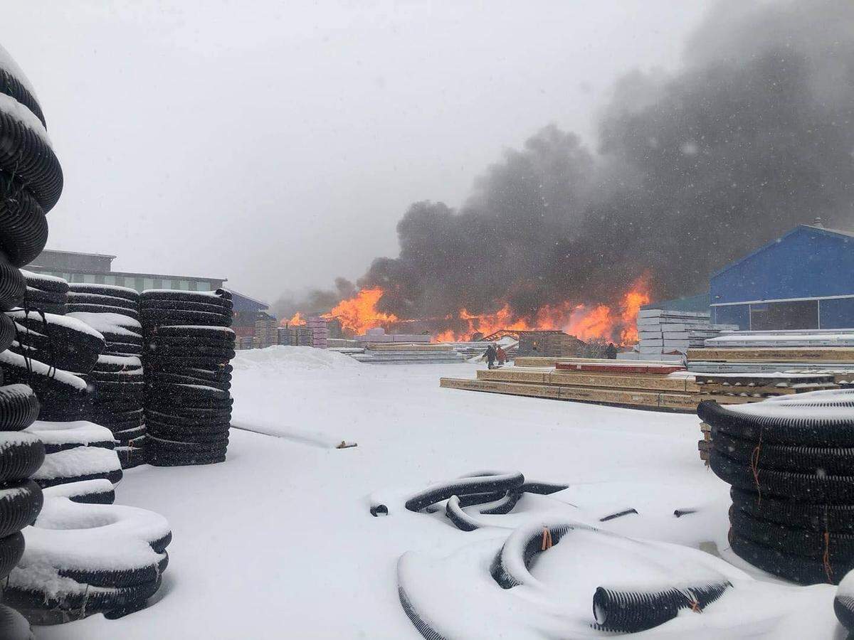 A fire destroyed an outbuilding full of windows, doors, kitchen cabinets, mouldings and other millwork products on R.P. Lumber property in Edwardsville on Monday.