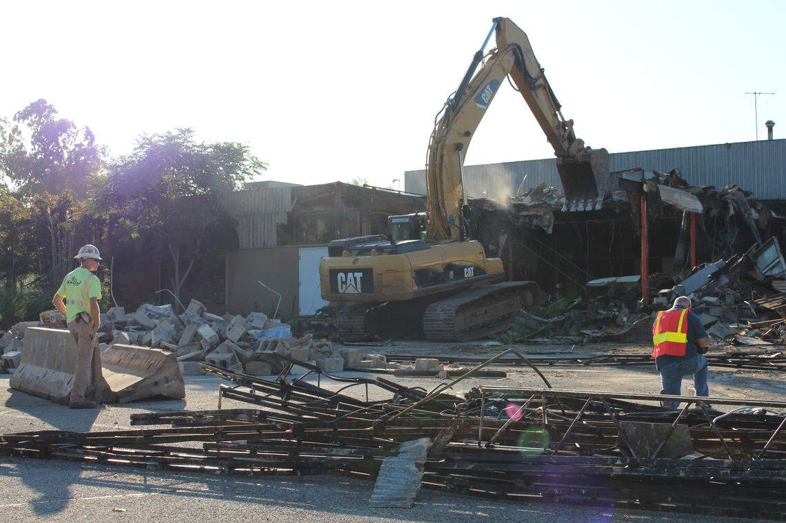 An excavator tears away walls of the former Rusty’s Restaurant in Edwardsville on Wednesday morning. The fine-dining establishment operated from 1958 to 2008.