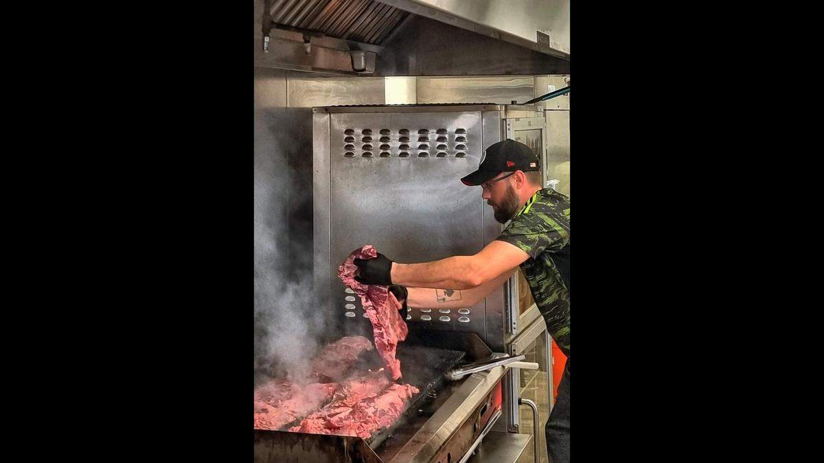 Yummy Rice Bowls chef-owner Nick Parraco grills beef for his made-to-order Asian-influenced rice bowls.
