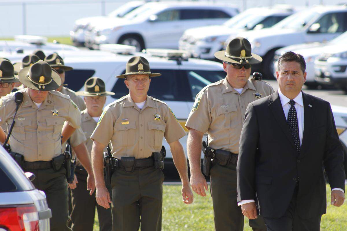 More ISP troopers arrive for the visitation of fallen Trooper Nicholas Hopkins.