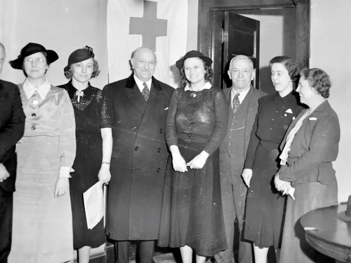 Gov. Henry Horner met with officials from the American Red Cross at the organization's emergency headquarters in Belleville. From left: Thora Ingebritson, Grace Wise, Gov. Horner, Betty Cowles, Belleville Mayor George Remnsnider, Frances Blackburn and Odelia Rinderer.
