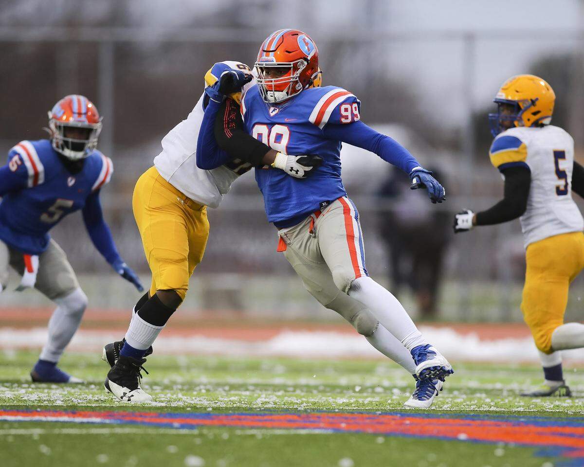 November 12, 2022 - East St. Louis, IL - East St. Louis defensive end Keandre McClendon rushes the passer during the IHSA, 6A, Quarterfinal playoff game between Crete - Monee and East St. Louis. The 45-0 victory will advance the Flyers to the Semifinals. [Photo: Chris Johns]