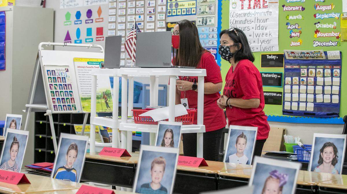 Photos of Maryville Elementary 2nd grade students were placed at their desks to help the teachers make a connection with the students. . 2nd grade teachers Carolyn Pirtle and Michaela Genovese-Moss work together to teach their students during an online class.