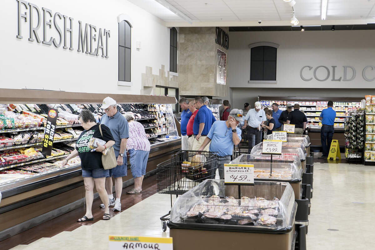 Shoppers check out Freeburg Country Mart, which opened Tuesday off State Street. The new store has grocery, produce, dairy, meat, deli, bakery, frozen and liquor departments, as well as a pharmacy.