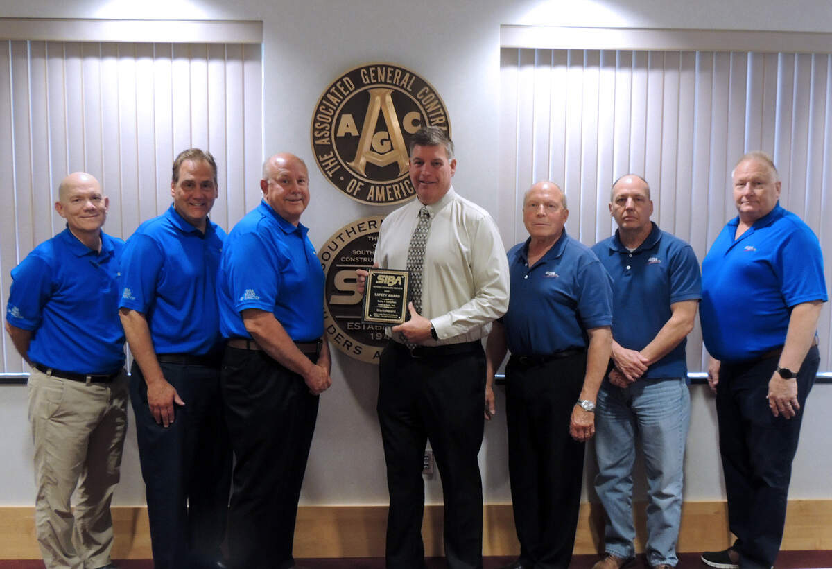 Korte & Luitjohan Vice President John Whitworth, center, accepts the Safety Merit Award from the Southern Illinois Builders Association’s board of directors.