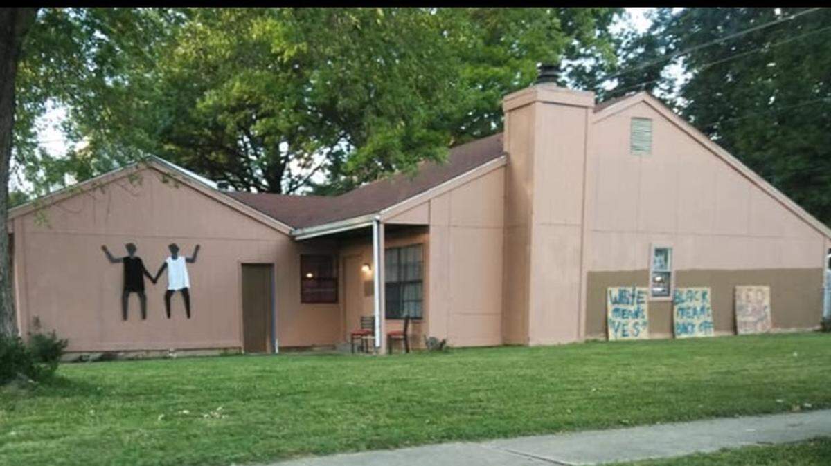 Signs outside the house in O’Fallon.