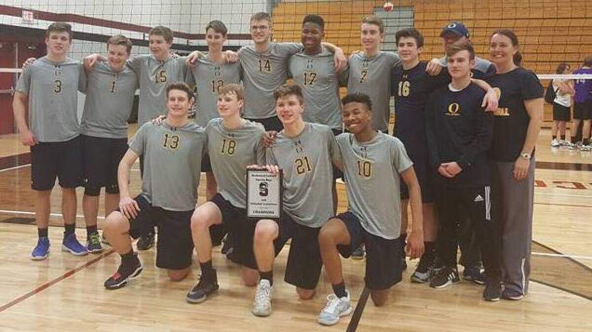 The O'Fallon Township High School boys volleyball team poses with its plaque after winning the Rockwood Tournament.